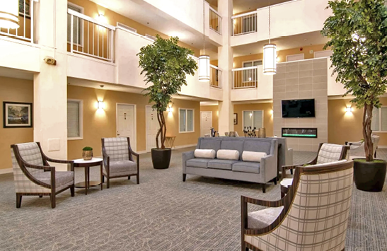 A large lobby with a television, couches, and chairs. AI generated content